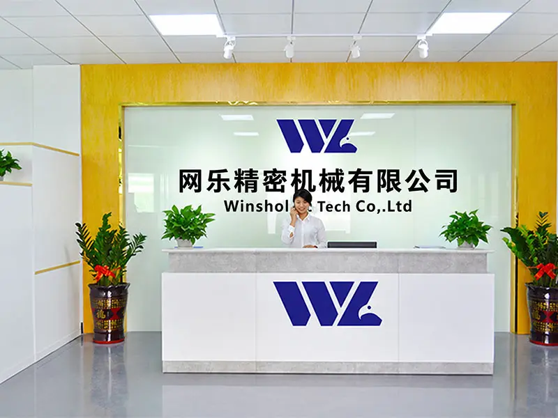 Winshol reception desk with the company logo and a staff member